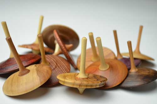 Assorted natural color wood spinning tops